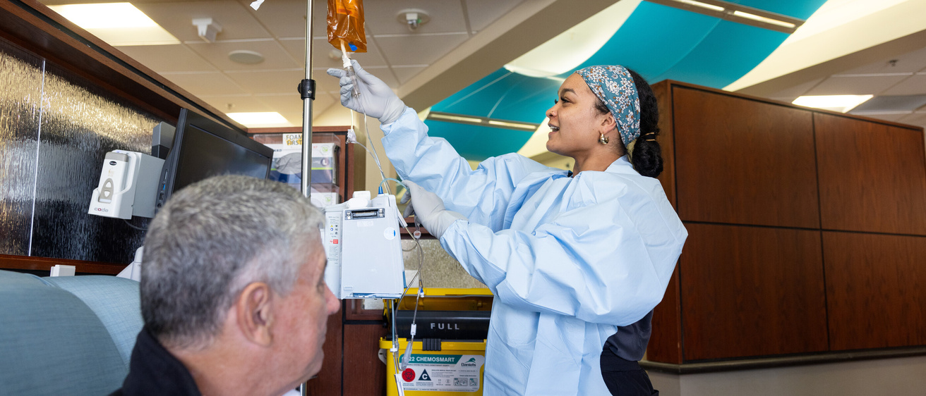 Staff nurse Sydnee Turner RN BSN in the infusion center at Holden Comprehensive Cancer Center on the UI Health Care university campus on Monday, May 5, 2025. Patient consent on file. 