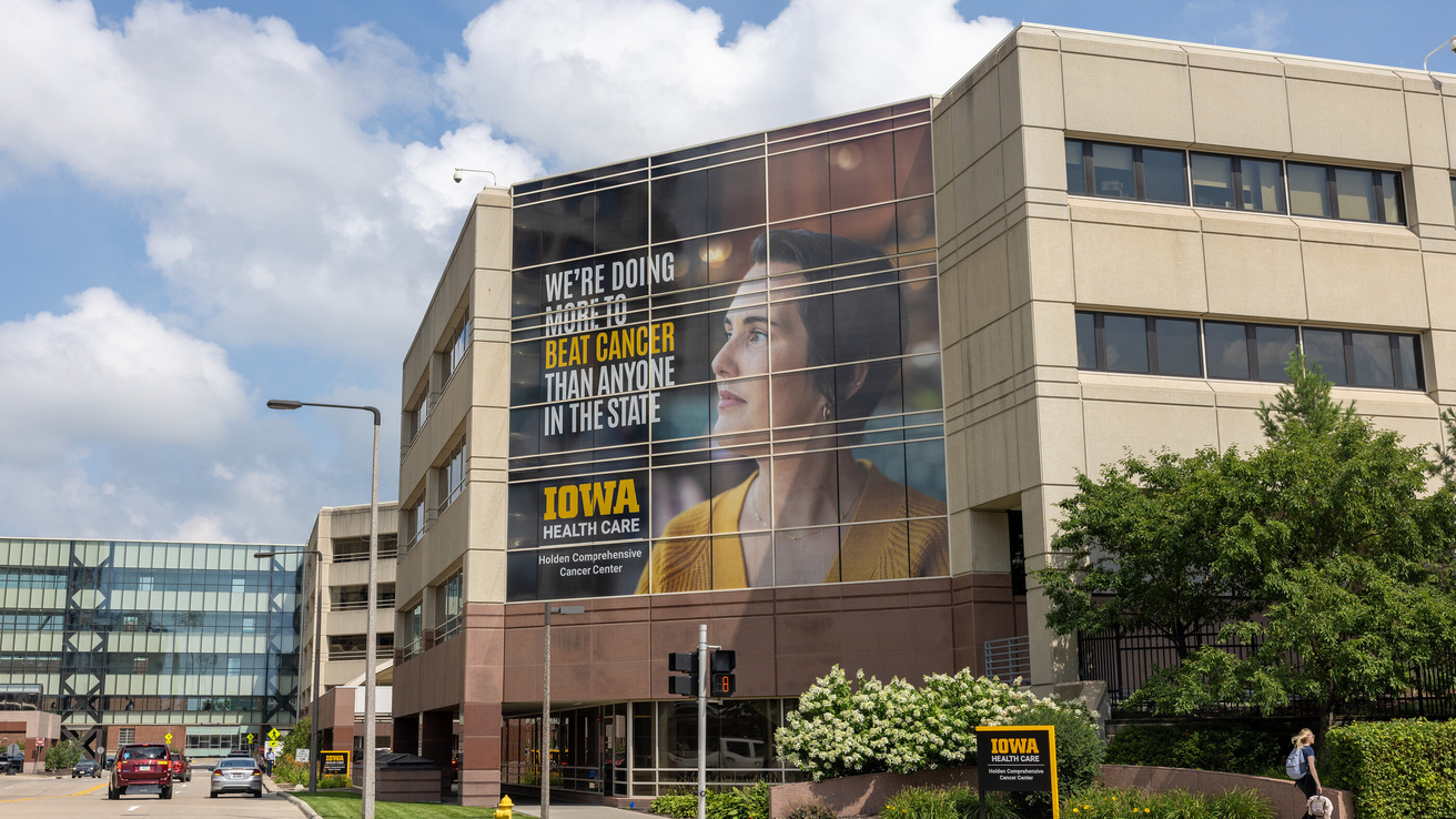 Exterior of Holden Comprehensive Cancer Center with new brand campaign display at University of Iowa Health Care’s university campus on Tuesday, July 22, 2025.